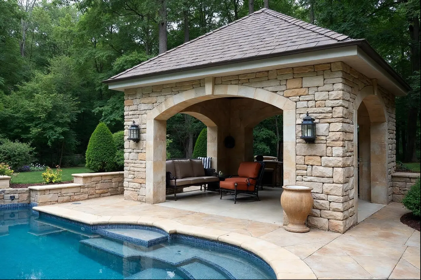 Outdoor stone fireplace on a Main Line pavilion built by Great Valley Landscape & Pool